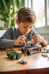 Fotobehang A boy repairing a toy robot © piai