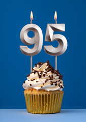 Vertical birthday card with cake - Lit candle number 95 on blue background