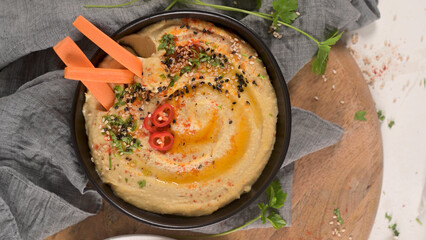 Delicious hummus in ceramic bowl