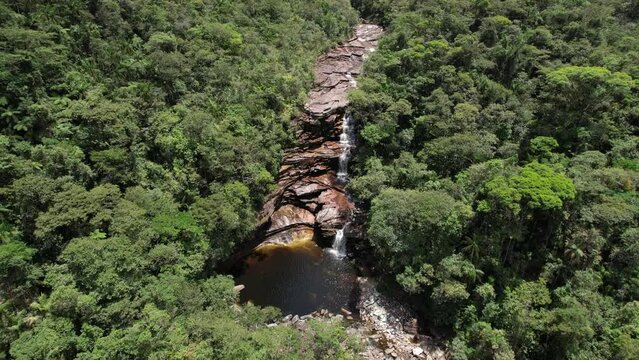 Calisto Waterfall, Vale do Pati, Chapada Diamantina, Bahia, Brazil. Valley with cerrado and caatinga biome, waterfall, abundant nature, hills, valley and canyons
