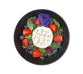 Bowl of delicious salad with brie cheese, blueberries and strawberries isolated on white, top view