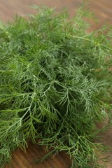 Fresh green dill on wooden table, closeup