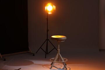 Casting call. Chair and lamp in modern studio