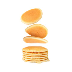 Many tasty fresh pancakes falling on white background