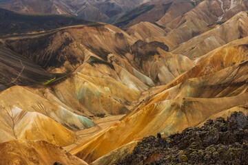 Multicolored mountains seen in Landmannalaugar, a location in Iceland's Fjallabak Nature Reserve in...
