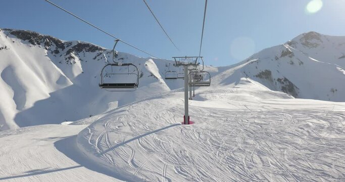 Ski lift ascent in snowy ALps