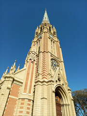 Fototapeta na wymiar Neogothic facade of San Isidro Labrador Cathedral, from 1898, in Buenos Aires Province, Argentina