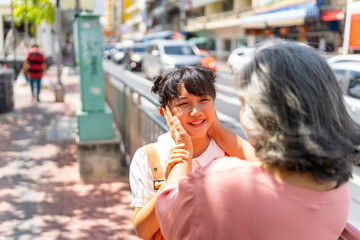 Happy Asian family grandmother and grandchild girl walking and shopping together at street market. Senior woman and little girl enjoy and fun outdoor lifestyle travel in the city on summer vacation. - obrazy, fototapety, plakaty