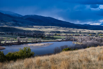 2021-03-09 OPEN LAND AND A MOUNTIN RANGE WITH A RIVER RUNNING THROUGH IT IN PRAY MONTANA