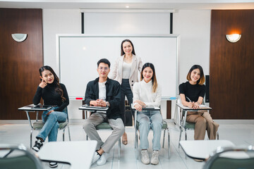 University College instructors and advisors meet female college students to advise their research study. University in classroom campus, college professor teacher and asian students discuss, teamwork 