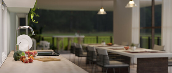 Side view close-up image of a minimal wood kitchen countertop in a modern luxury spacious kitchen.