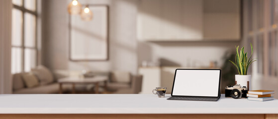 A white-screen digital tablet mockup on a white tabletop in a modern living room.