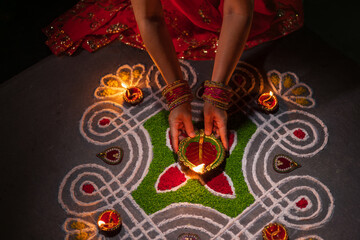 Clay diya lamps lit during diwali celebration, Diwali, or Deepavali, is India's biggest and most important holiday.