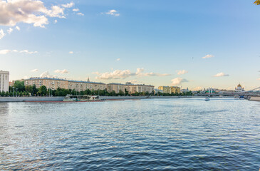 Cruise ship sails on the Moscow river in Moscow city center, popular place for walking.