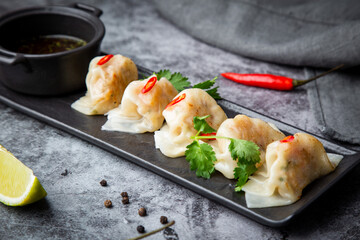 steamed dumplings with herbs, chili and soy sauce