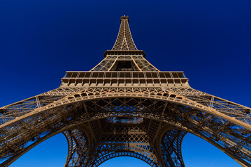 Eiffel Tower with sunny blue sky in Paris, France