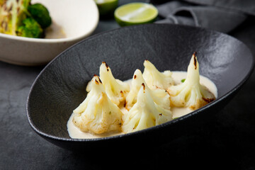 aesthetic cauliflower in white tahini sauce with lime