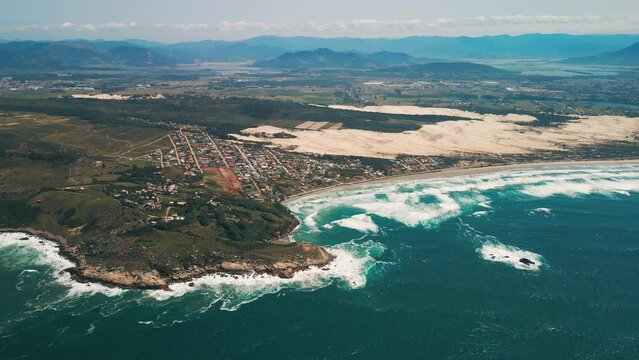 Aerial view of the Brazilian coastline with rough Atlantic Ocean. Area near the town of Imbituba