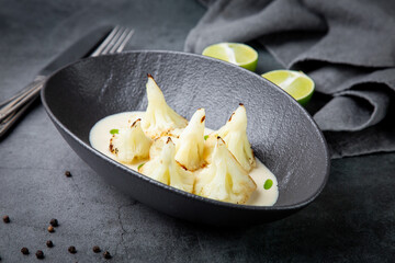 aesthetic cauliflower in white tahini sauce with lime