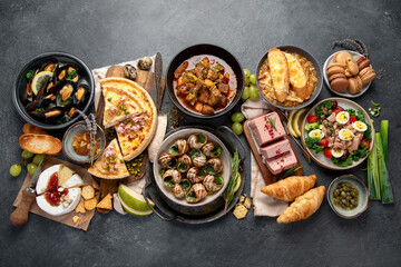 Traditional french food -mussel and meat dishes, ratatouille, snails, croissants, desserts, fresh...