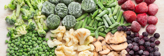 A set of foods for the winter. Various of frozen vegetables and berries