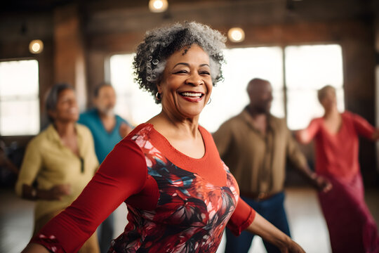 Happy senior retired black woman dancing during dance course