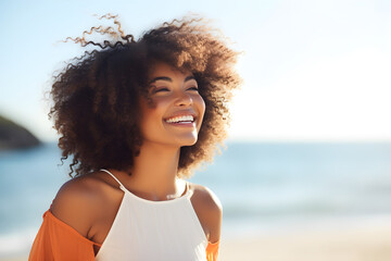 Happy beautiful young black woman smiling at the beach