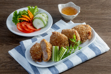 Crispy thai prawn cake on the wooden table