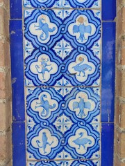 Mediterranean ancient ceramic tile in blue colors with ornaments and animals.