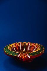 Diwali joy captured in the glow of colorful clay diya lamps, signifying prosperity and happiness,...