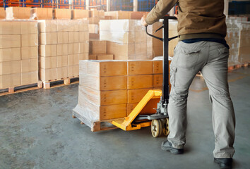 Workers Unloading Package Boxes Wrapped Plastic on Pallets in Storage Warehouse. Cardboard Boxes, Parcels, Warehouse Shipping, Supply Chain Distribution Storehouse, Supplies Shipment Boxes. Logistics