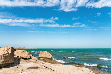 Fototapeta na wymiar Rocky sea shore with beautiful turquoise water
