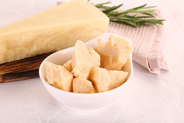 Chopped Italian hard parmesan cheese