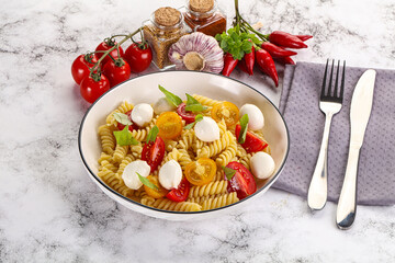 Italian pasta with mozzarella and tomato