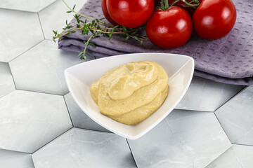 Dijon mustard sauce in the bowl