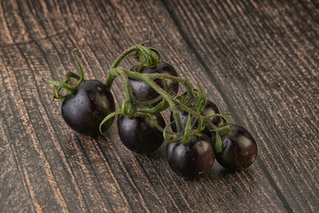 Ripe tasty black cherry tomato