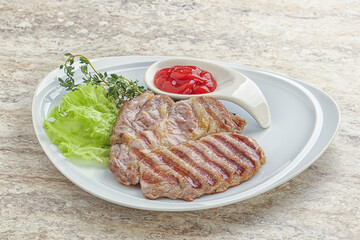 Grilled pork neck steak with ketchup
