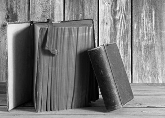black and white still life with old books on the table