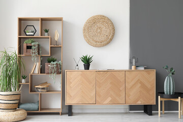 Wooden cabinet and shelving unit in interior of stylish room - obrazy, fototapety, plakaty
