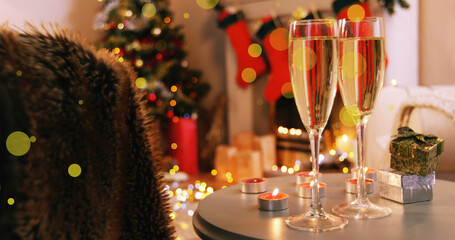 Abstract vector illustration of champagne glasses and gifts on table in living room