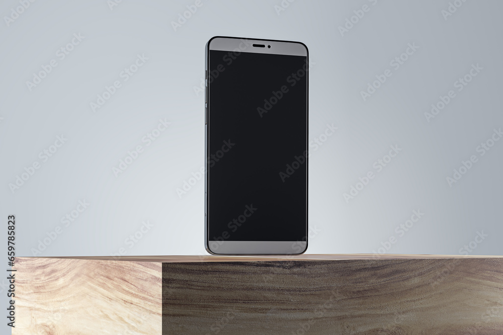 Poster close up of blank smartphone screen on wooden surface and gray wall background. product presentation