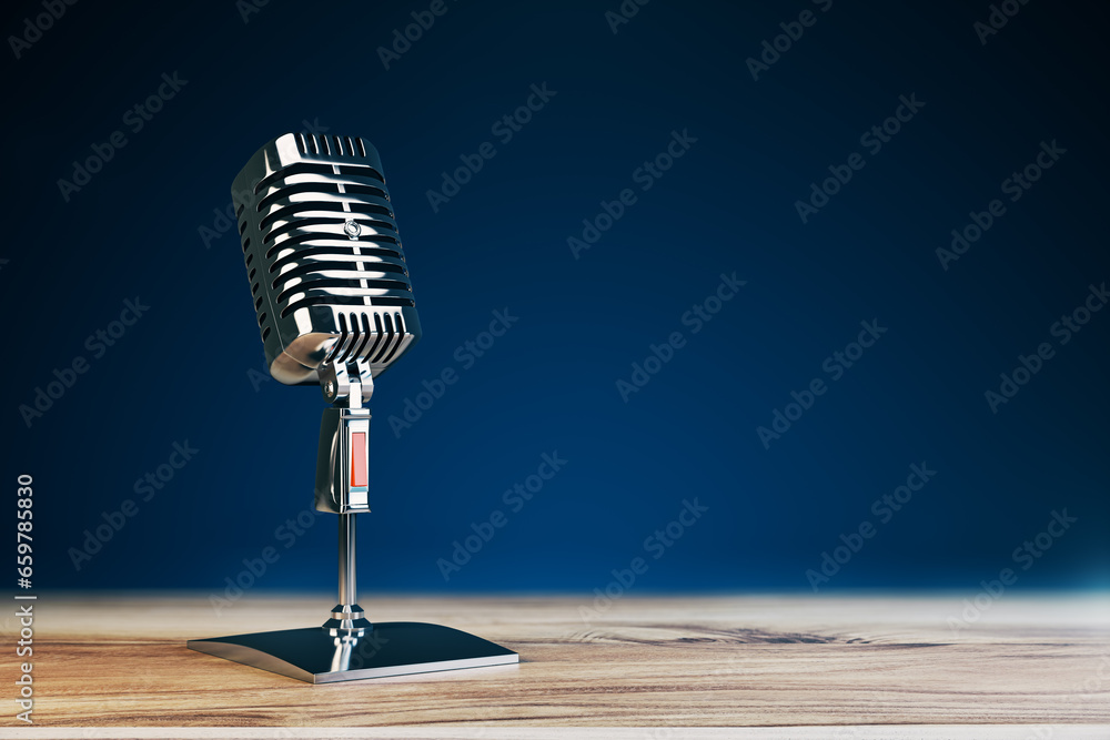 Poster close up of steel vintage singing vocal microphone on wooden surface and blue background with mock u
