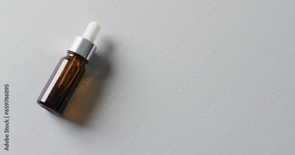 Poster video of make up bottle with pipette and copy space on white background