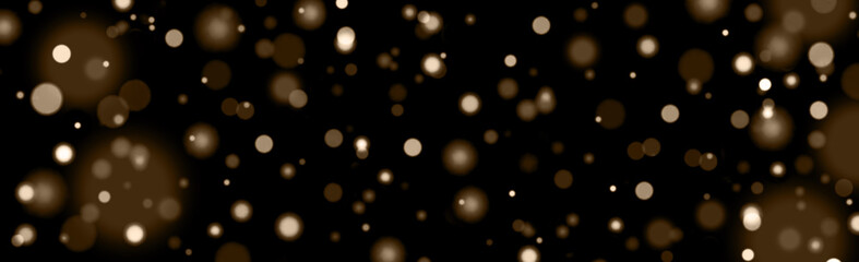 abstract background gold color champagne bokeh glitter lights on a black background