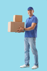 Mature courier with parcels on blue background