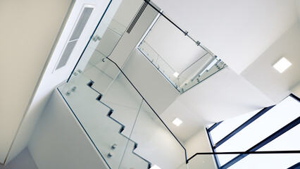modern architecture interior stairs white walls and glass, LED lighting and black marble.