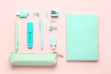 Stylish pencil case with school stationery on pink background