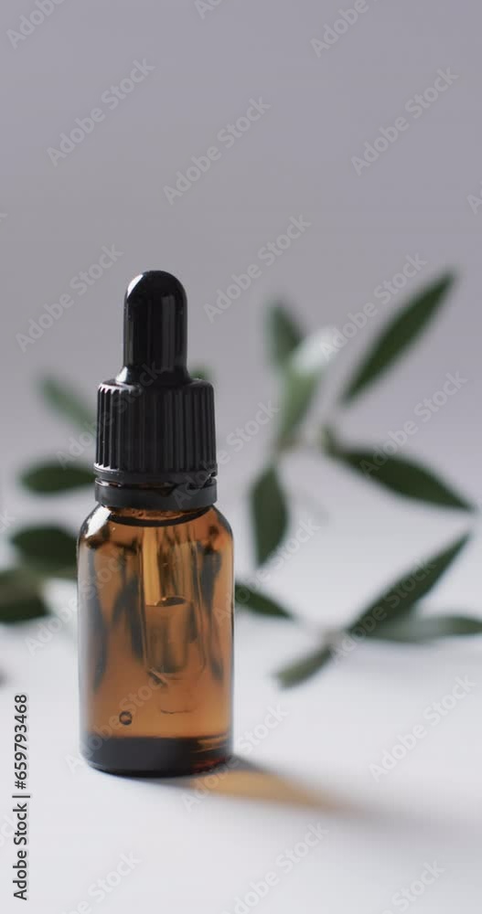 Poster vertical video of make up bottle with pipette and copy space on white background