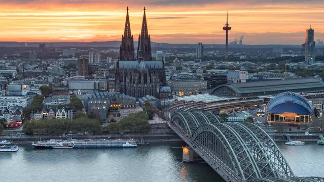 Cologne skyline aerial view time lapse from da to night, koln germany city view from above beutiful sunset over cologne cathedral in old town. Cologne bridge and dome.