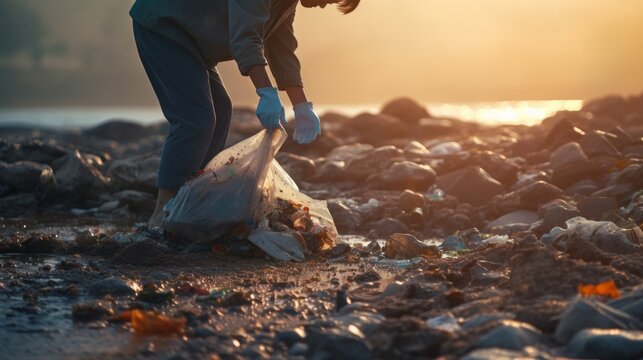 Close-up of group of environmental volunteers collecting plastic garbage on the beach - Ocean pollution, environmental protection and ecology concept. environmental pollution